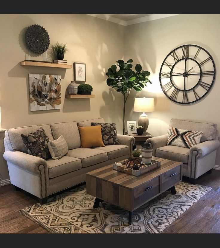 a living room with two couches and a coffee table in front of a clock