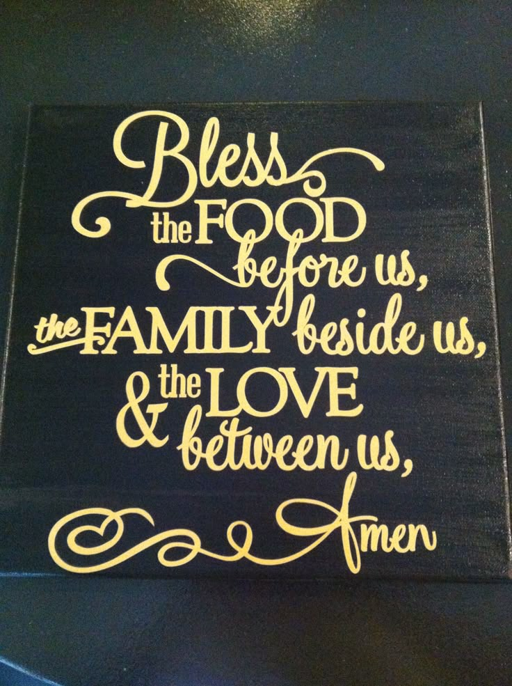 a wooden sign that says, blessing the food before us, family beside us, and love between us, amen