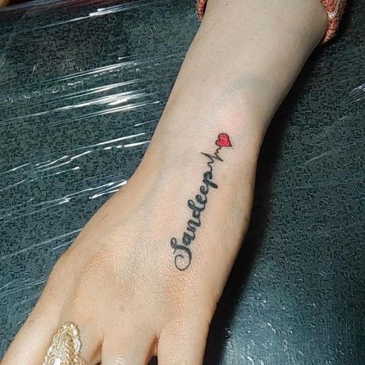 a woman's foot with a tattoo that reads, love is forever on it