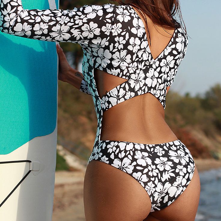 DETAILS One piece swimsuit Polyester, spandex Stretchy and smooth fabric Cold gentle machine wash Print placement may vary Product ID: SX220628001 Flower Bathing Suits, Long Sleeve Bathing Suit, Backless One Piece Swimsuit, Uv Shirt, Long Sleeve Swim, Bathing Suits One Piece, Rashguard Swimsuit, Swimsuits Outfits, Rash Guard Women