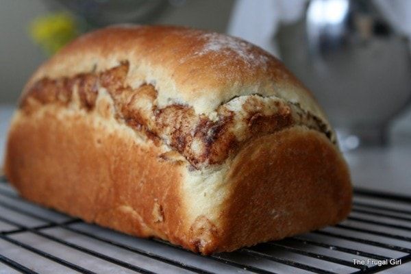 a loaf of bread sitting on top of a cooling rack