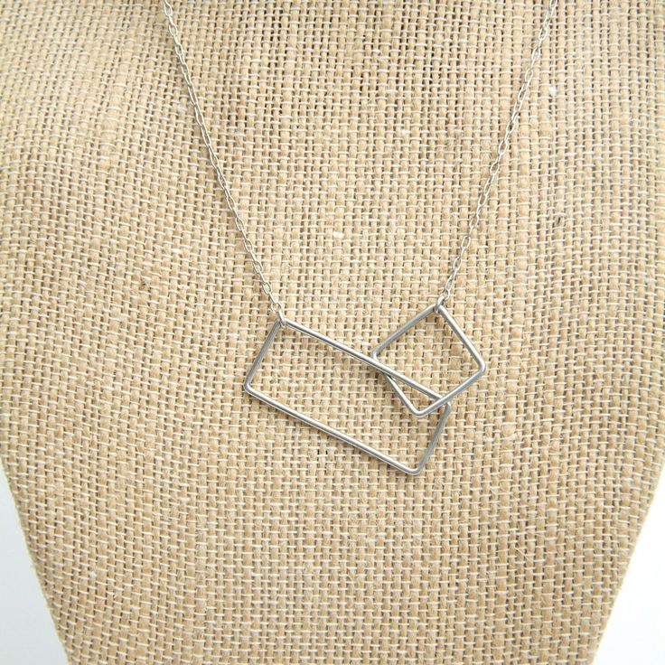 "This simple, minimalist design makes quite visual impact.  The graphic nature of the two open squares really draws your eye to this piece.  It can be worn with almost anything you choose to pair it with, making it an excellent addition to your \"jewelry wardrobe.\"  Each piece in my shop is handmade by me.  It then gets cleaned and tumbled for a minimum of 8-10 hours, adding strength and a beautiful shine to the piece. This necklace can me made in a variety of lengths, as indicated in this list Minimalist Square Pendant Jewelry For Everyday, Modern Rectangular Necklace, Modern Square Sterling Silver Jewelry, Modern Sterling Silver Square Jewelry, Minimalist Everyday Jewelry With Square Pendant, Minimalist Geometric Necklaces For Everyday, Modern Rectangular Jewelry For Everyday Use, Square Minimalist Jewelry For Everyday, Modern Rectangular Jewelry For Everyday