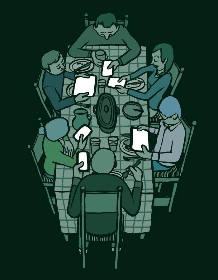 a group of people sitting around a dinner table