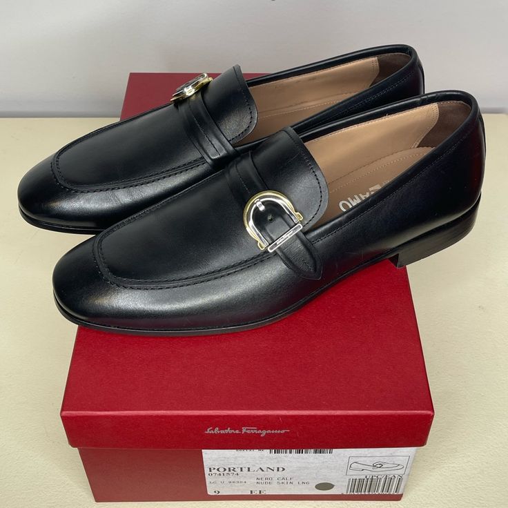 Salvatore Ferragamo "Portland" Loafers In Smooth Calf Leather. Stacked Heel. Apron Toe. Notched Vamp. Gancio Ornament Buckle Strap. Slip-On Style. Made In Italy. Only Worn Once And In Brand New Condition. Comes With Original Box. Size Is 9 Ee. Please Confirm Sizing Before Buying Or Bidding. Designer Monk Strap Slip-on Shoes For Semi-formal Occasions, Designer Tassel Loafers With Rubber Sole For Business, Designer Monk Strap Shoes With Leather Sole, Designer Business Loafers With Rubber Sole, Designer Business Tassel Loafers With Brogue Detailing, Designer Tassel Loafers With Leather Sole, Designer Goodyear Welted Loafers For Semi-formal Occasions, Designer Business Loafers With Branded Heel Counter, Designer Brogue Loafers For Business Casual