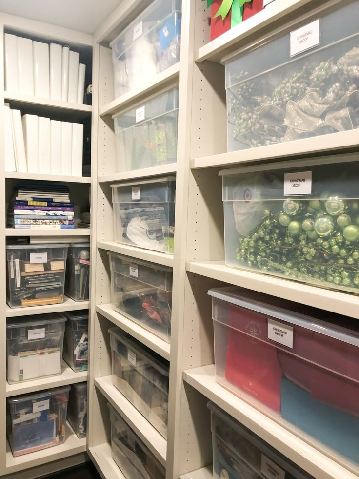 the shelves are filled with many different types of items and containers for storing books, papers, and other things