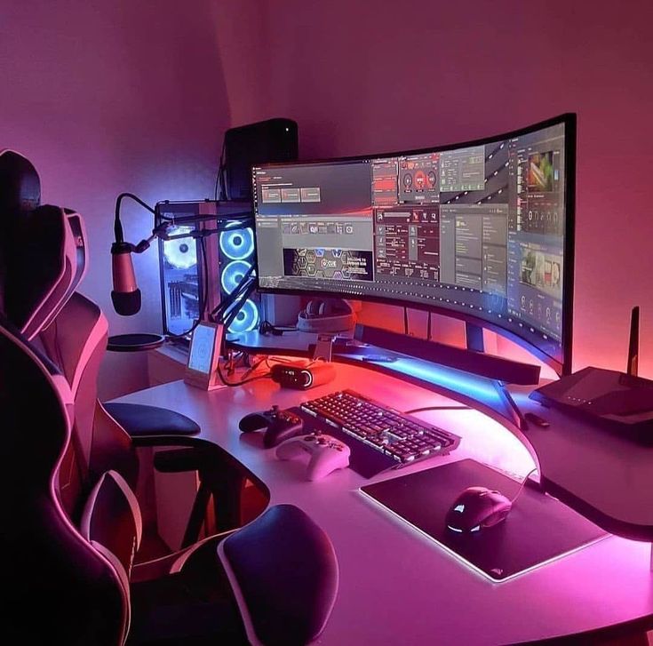 a computer desk with two monitors, keyboard and headphones on it in front of a purple light