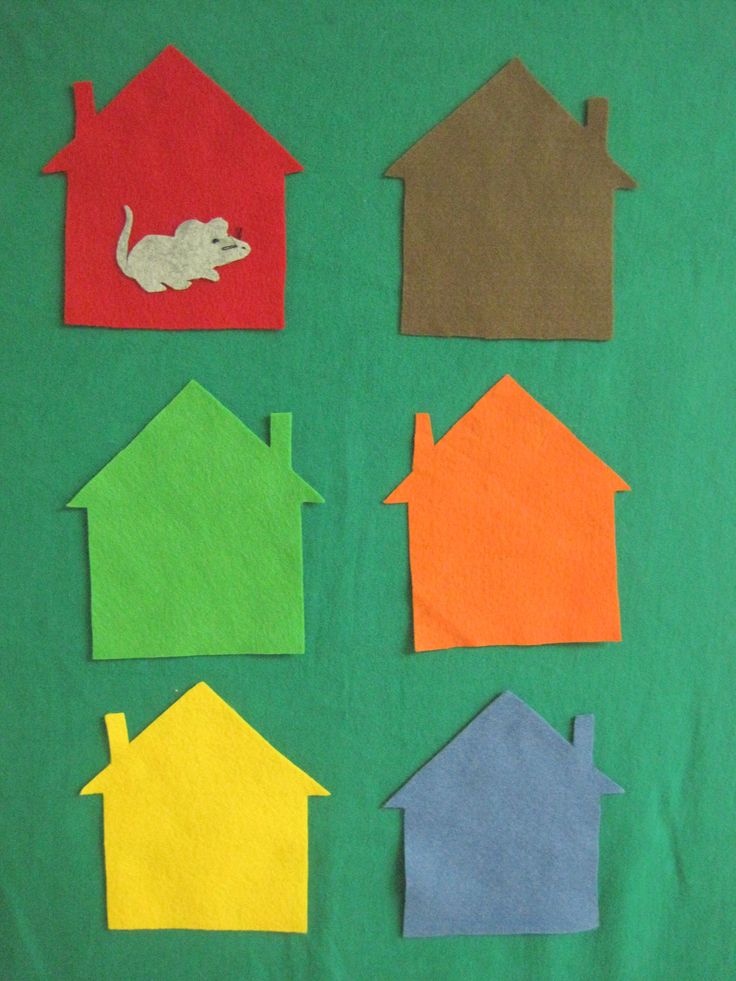 the paper houses are cut out to look like they're made from construction paper