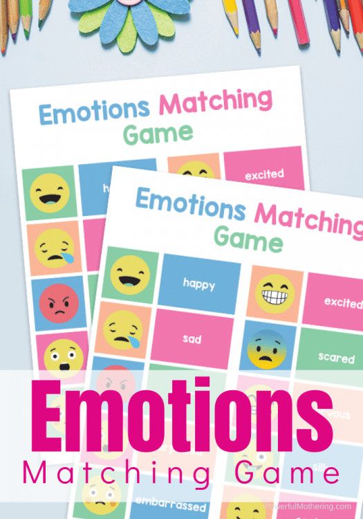 emotions matching game with pencils and crayons on the table next to it