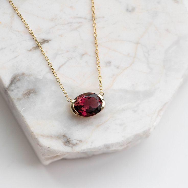 Red Tourmaline Necklace 14K Gold - Rubellite Oval Solid Gold Pendant - Anniversary Gift for Her - Kyklos Jewelry GN00036 ● Metal: 14K solid gold ● Gemstone: Red Tourmaline ● Gemstone's weight: 3.20 ct ● Length: 40 cm G I F T S All our pieces are delivered beautifully packaged and gift ready. The gift wrap consists of a jewelry box and a paper bag with our logo. P R O D U C T I O N ∙ T I M E * S H I P P I N G * P O L I C I E S Please keep in mind that each item is handcrafted, and we need 5 days Elegant Oval Garnet Necklace, Yellow Gold Garnet Necklaces With Oval Shape, Formal Oval Garnet Pendant Jewelry, Yellow Gold Oval Garnet Necklace, Oval Garnet Necklaces For Anniversary, Oval Garnet Necklace For Anniversary, Gold Oval Garnet Necklaces, Oval Tourmaline Jewelry For Formal Occasions, Oval Garnet Gold Necklace