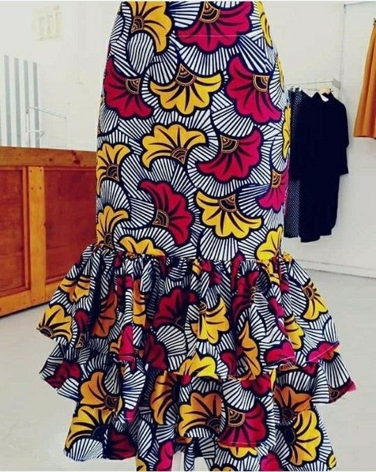 This is a floral kitengi print Chitenge Skirts Designs, Long Chitenge Skirts, Ankara Skirts Designs, Chitenge Skirts, Ankara Skirt Styles, Ankara Skirts, Skirt Styles, African Print Skirt, African Skirts