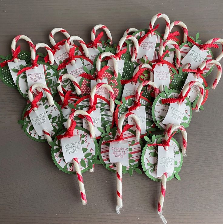 many candy canes are wrapped in red and green paper