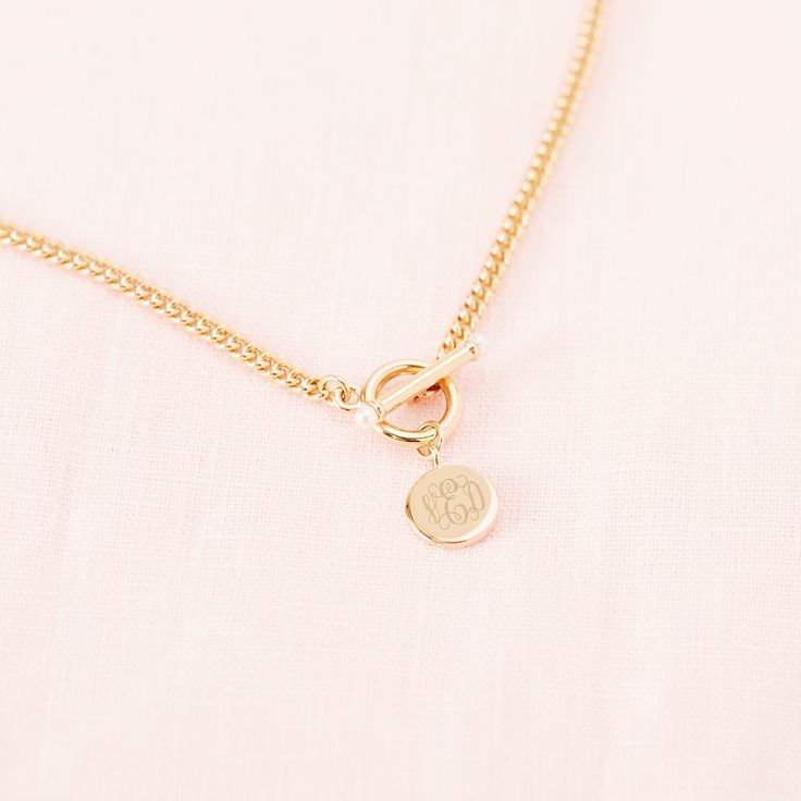 Pearls - purity, generosity, integrity. Inspired by preppy classics, the Stella Pearl Toggle Necklace is a statement necklace that combines several of our favorite details. The pearl-accented toggle is a stylish way to keep this necklace secure and the pendant can be personalized with either your initials or your monogram in your choice of engraving styles. #pearls #necklace #pearlnecklace #bridesmaidsgift Classic Initial Pendant Chain Necklace, Classic Pearl Charm Toggle Necklace, Classic Toggle Necklace With Pearl Charm For Gift, Classic Charm Necklaces With Lobster Clasp, Classic Everyday Necklace With Toggle Clasp, Elegant Toggle Necklace For Anniversary, Chic Toggle Necklace As A Gift, Classic Toggle Clasp Necklace As Gift, Elegant Monogram Charm Necklace For Personalized Gift