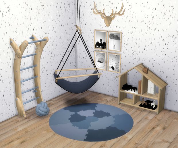 a room with wooden floors, a blue rug and a hanging chair in the middle