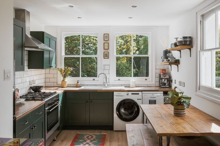 the kitchen is clean and ready to be used as a washer / dryer