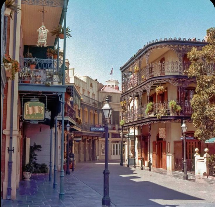 an old fashioned street scene with buildings on both sides