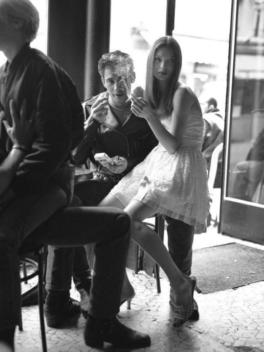 black and white photograph of two people sitting at a table