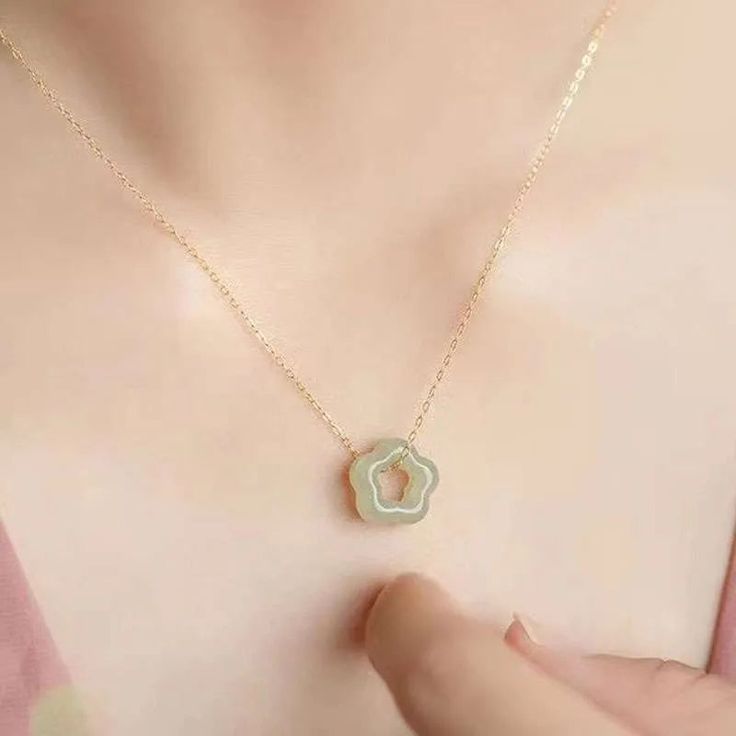 This Flower Jade Necklace is the perfect addition to take your outfits from everyday to extraordinary. Crafted with a minimalist aesthetic and design, this elegant piece features the unique beauty of jade and is sure to turn heads. The perfect balance of beauty and sophistication, this necklace is sure to elevate any look. Jade Clavicle Chain Necklace, Elegant Green Flower Pendant Necklaces, Elegant Green Flower Pendant Necklace, Elegant Jade Necklaces As Gifts, Elegant Jade Necklaces For Gifts, Elegant Jade Necklace With Adjustable Chain, Elegant Jade Necklace As Gift, Elegant Jade Necklace For Gifting, Chic Flower Shaped Necklace For Gifts