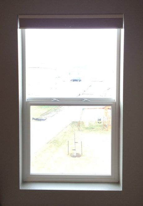 a window in the corner of a room