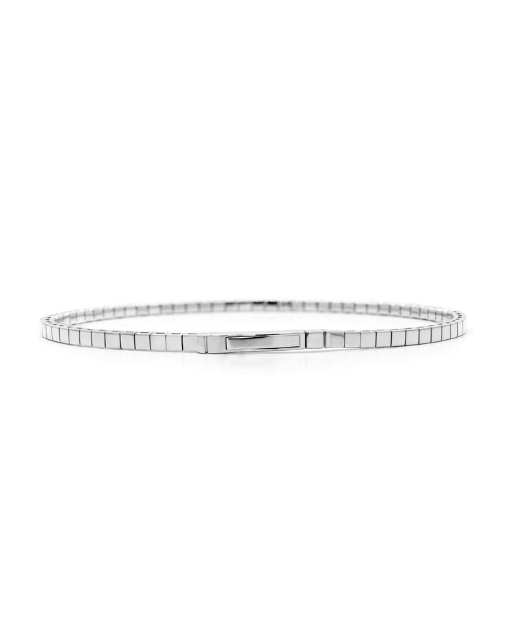 Our half bangle reiterated in 1 carat of diamonds, this bracelet features a uniquely flexible design due to a titanium wire woven within the links. Carat | 1 ctw (+/- .01cts)Clarity | SIColor | DEFCut | Round BrilliantGold | 14 karat Note: In-stock products ship same-day or next-day depending on the time of your order. For made-to-order items please allow up to 1-3 weeks to ship your newest piece of fine jewelry. Classic White Gold Metal Bangle, White Gold Sterling Silver Jubilee Bangle, Silver Flexible Bangle For Formal Occasions, Formal Metal Bracelets, Flexible Metal Bracelets For Formal Occasions, White Gold Jubilee Cuff Bracelet Bangle, Classic White Gold Diamond Bracelet With Oyster Clasp, White Gold Jubilee Bangle Cuff Bracelet, Timeless Flexible Diamond Bangle Bracelet