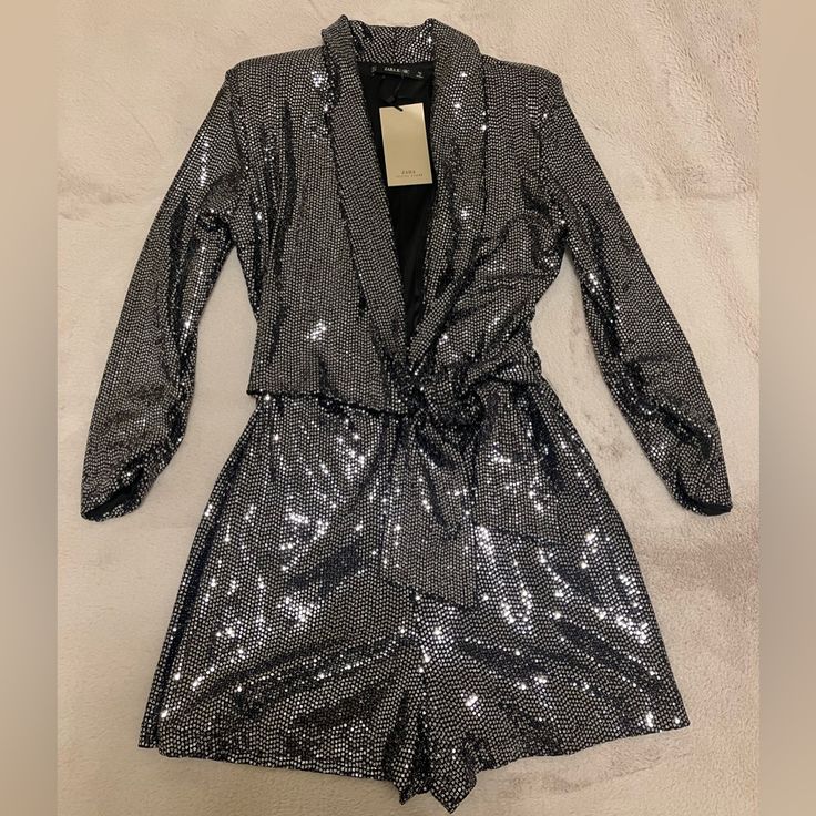 Black & Silver Zara Shorts Romper With Tags. Item Was Not Worn. Metallic Long Sleeve Jumpsuits And Rompers For Night Out, Metallic Long Sleeve Jumpsuits For Night Out, Metallic Long Sleeve Jumpsuits And Rompers For Party, Metallic Sequined Jumpsuits And Rompers For Party Season, Zara Silver Bottoms For Party, Zara Silver Party Bottoms, Metallic Sequined Jumpsuits And Rompers For Night Out, Glamorous Metallic Silver Party Bottoms, Elegant Silver Bottoms From Zara