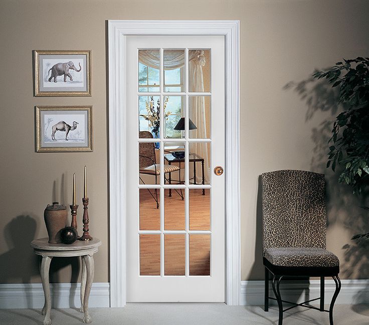 a living room filled with furniture and a white door