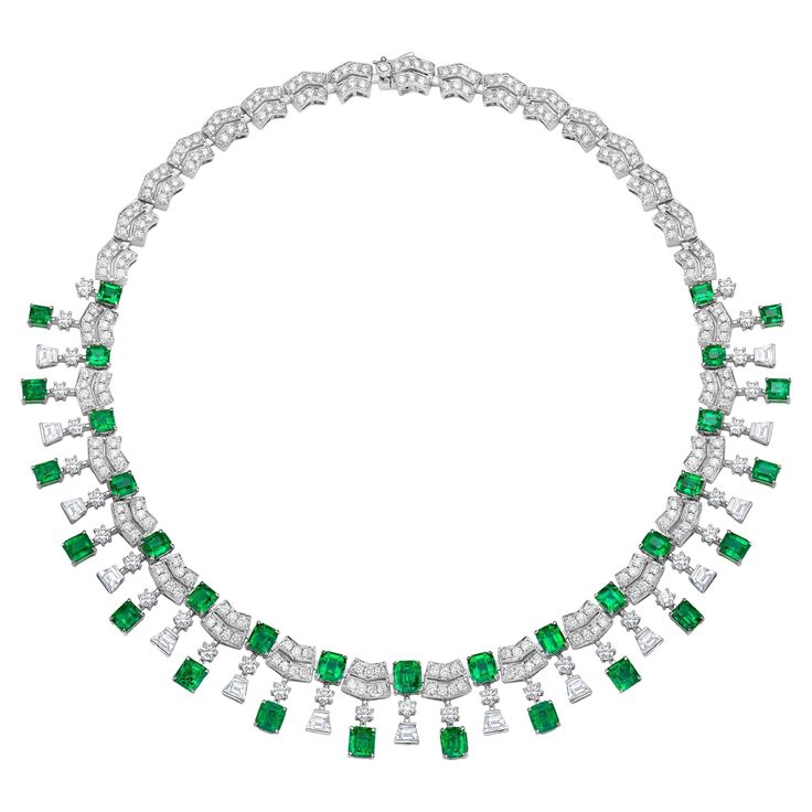 The Princess Necklace is uniquely designed with the finest Colombian Emeralds paired with dazzling round and trapezium diamonds. The unique art deco geometry of this layout creates a structured frame that gives attention on each enchanting emerald. The emeralds are intricately set in yellow gold, whilst the diamonds are set in white gold to give the necklace a royal and regal touch. #BridalJewellery by Sunita Nahata Fine Design. Feel beautiful on your special occasion. Art Deco Colombian Emerald Emerald And Diamond Necklace, Art Deco Pendant Necklace, Bridal Diamond Necklace, Princess Earrings, Diamond Earrings Design, Antique Necklaces, Princess Necklace, Jewelry Design Drawing, Colombian Emeralds