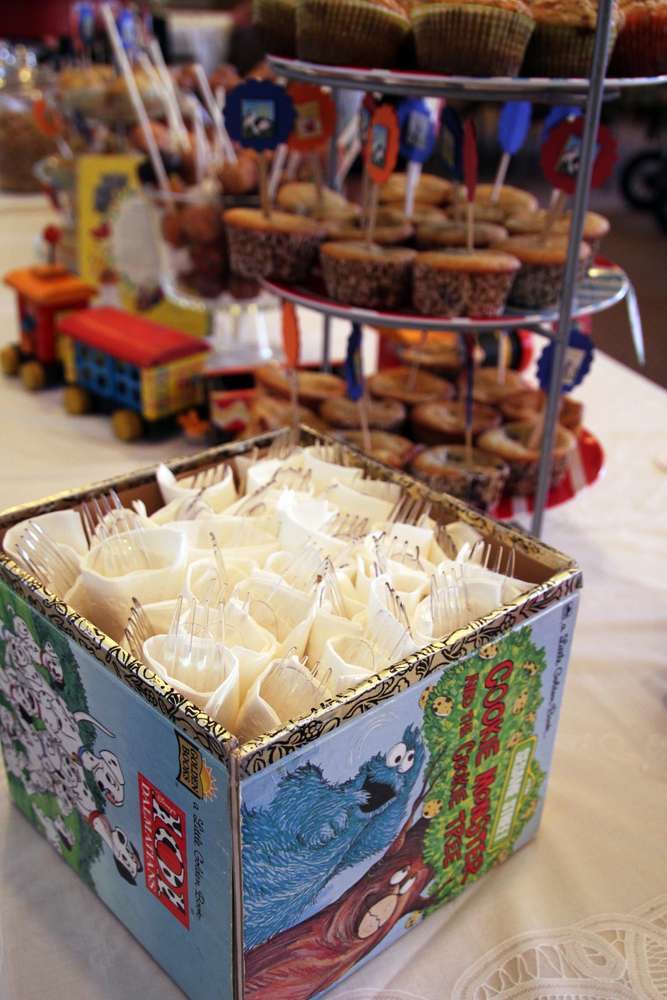 a box filled with lots of food sitting on top of a table next to other foods