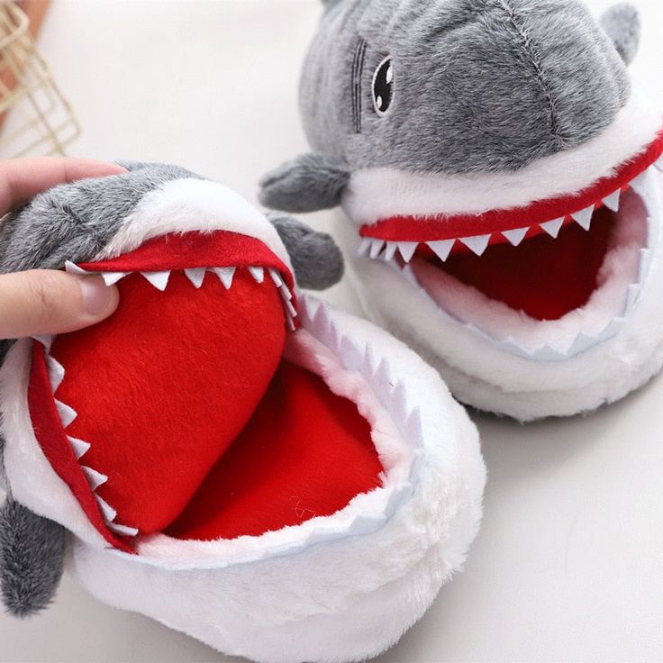 CUTE SHARK DESIGN: Decorated with a Shark, this pair of slippers looks really cute. You'll feel happy when seeing the adorable slippers when coming back home. A day's tiredness will be reduced soon. COMFORTABLE AND SOFT: The slippers are made with high quality 1”thick foam footbeds, soft polyester plush, and terrycloth details. Soft plush slipper will keep your toes warm. This style of slipper is anti-slip designed, you do not need to worry about slipping in the living room. Solid high density m Shark Funny, Fun Slippers, Funny Shoes, Shark Slippers, Shark Plush, Large Size Womens Shoes, Animal Cushions, Sharks Funny, Indoor Slippers