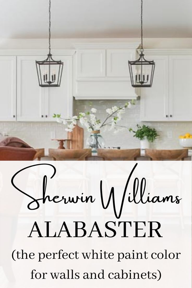 a kitchen with white cabinets and chandelier above it is the title, shewin williams's abaaster