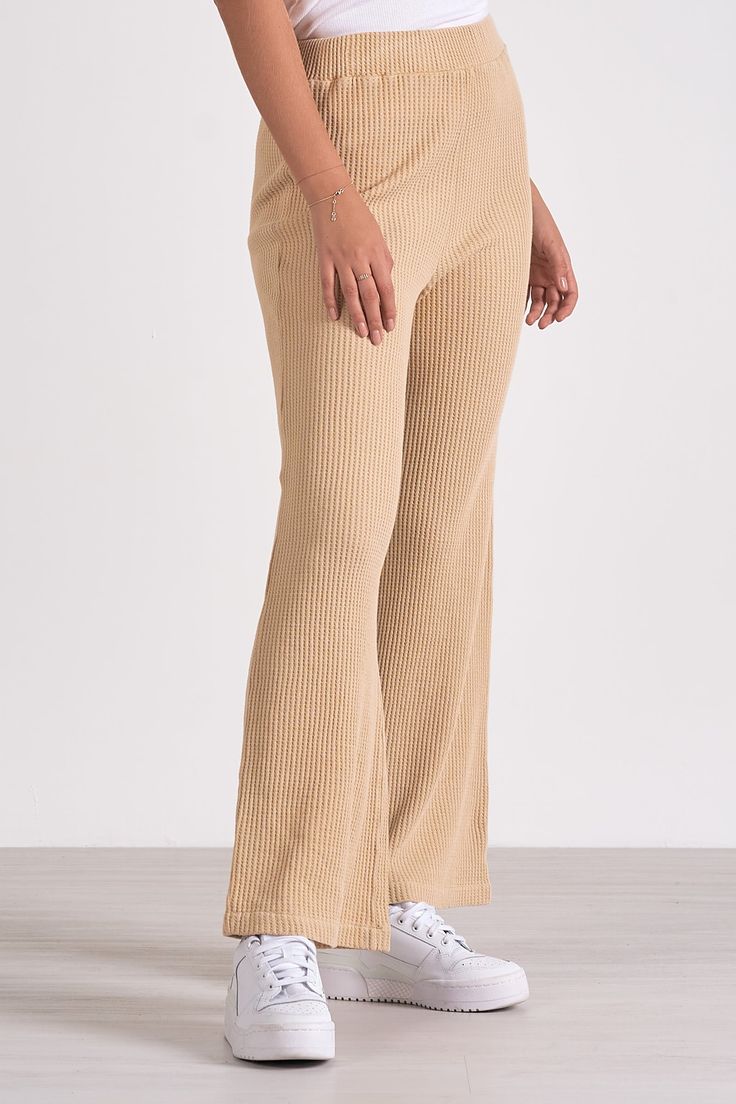 Lounge in luxury with Odie pants. These wide-leg waffle knit trousers merge sweatpant comfort with elevated style for a cozy yet chic look. Stretch Ribbed Wide Leg Pants, High-waisted Ribbed Wide Leg Pants For Fall, Solid Wide Leg Ribbed Pants, Ribbed Wide Leg Pants For Fall, Solid Ribbed Wide Leg Pants, Solid Color Ribbed Wide-leg Pants, Chic Wide Leg Ribbed Pants, Trendy Wide Leg Ribbed Bottoms, Comfy Ribbed Bottoms