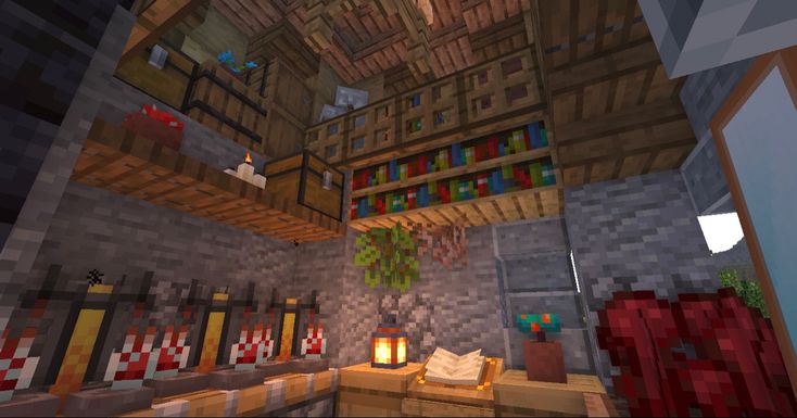 the inside of a minecraft house with lots of bookshelves and candles in it