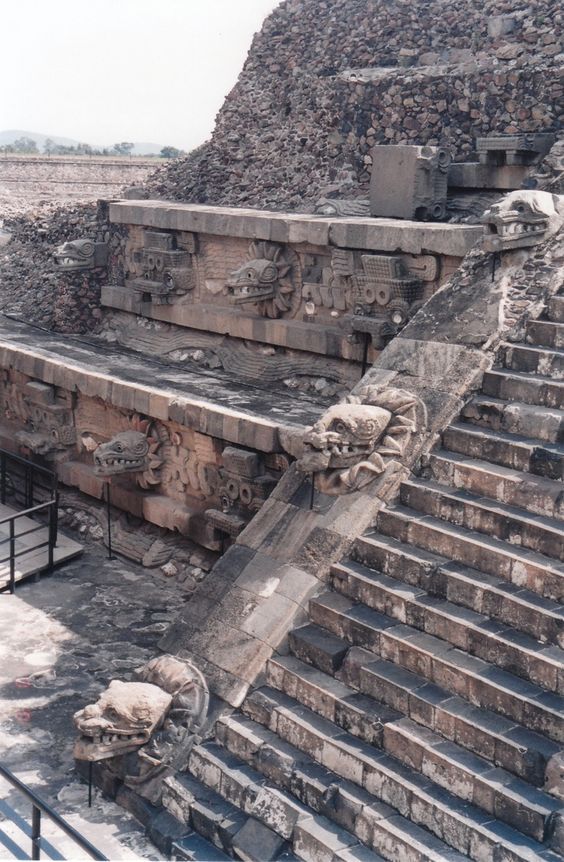 an ancient structure with steps and carvings on it