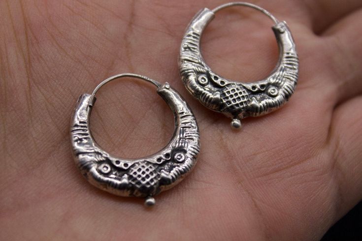 Ethnic Nepali solid pure Silver Earring-Tribal Jewelry- Ethnic Jewelry- Nepal 20th c A rare pair of small size solid pure silver earring. It has a simple design with two snakeheads. These well-made earrings are worn by women of various tribal groups for centuries. Oxidize silver, in good condition. Wt: 4g Origin: Nepal 20th c Traditional Round Engraved Earrings, Traditional Engraved Round Earrings, Traditional Sterling Silver Engraved Earrings, Traditional Engraved Round Hoop Earrings, Traditional Engraved Hoop Earrings Gift, Traditional Engraved Sterling Silver Earrings, Handmade Traditional Plug Earrings For Ceremonial Occasions, Ceremonial Sterling Silver Hallmarked Earrings, Handmade Antique Silver Plug Earrings