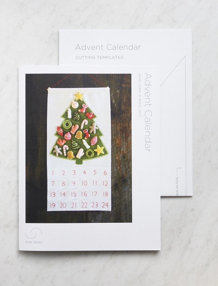 a calendar with a christmas tree made out of candies and candy on it's cover