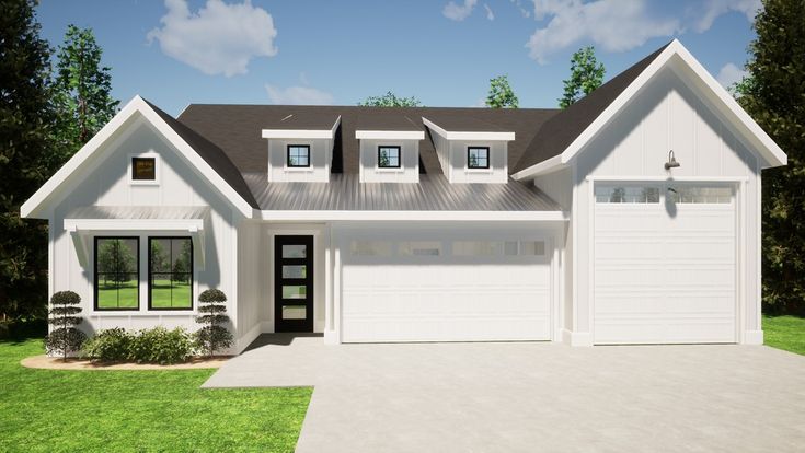 a white house with two garages in the front yard