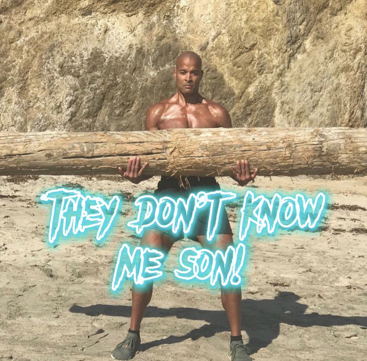 a man holding a large log with the words they don't know me son