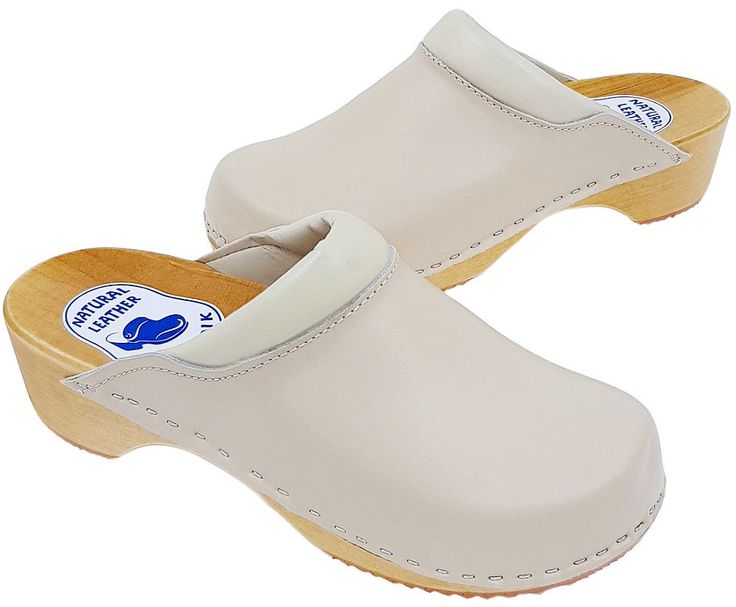 Clogs are made of natural leather + alder wood Instep finished with a soft sponge The sole is made of hard and abrasion-resistant PU material, so it can be used both indoors and outdoors. Ideal for people performing standing and walking work, e.g. shops, school, kitchen, clinic, etc. As well as for everyday use at home Advantages of wearing clogs : - do not chafe, absorb sweat, are anti-allergic, prevent foot fatigue and many others - bottom layer made of polyurethane, non-slip, dampens knocking, occurring during walking and protects the wooden part from the harmful effects of moisture and chemicals. POLISH PRODUCT DESCRIPTION AND DIMENSIONS ~~ MATERIAL: natural laminated leather (top) + alder wood + PU (sole). HEEL HEIGHT : 4,5 cm. COLOUR : BEIGE Size Chart  SIZE EU - 35 insert length - 2 Beige Slip-on Clogs With Rubber Sole, Classic Beige Clogs With Rubber Sole, Beige Closed Toe Clogs With Rubber Sole, Beige Non-slip Round Toe Clogs, Cream Closed Toe Clogs With Wooden Heel, Closed Toe Natural Clogs With Rubber Sole, Natural Color Closed Toe Clogs With Rubber Sole, Natural Closed Toe Clogs With Rubber Sole, Cream Closed Toe Clogs With Removable Insole