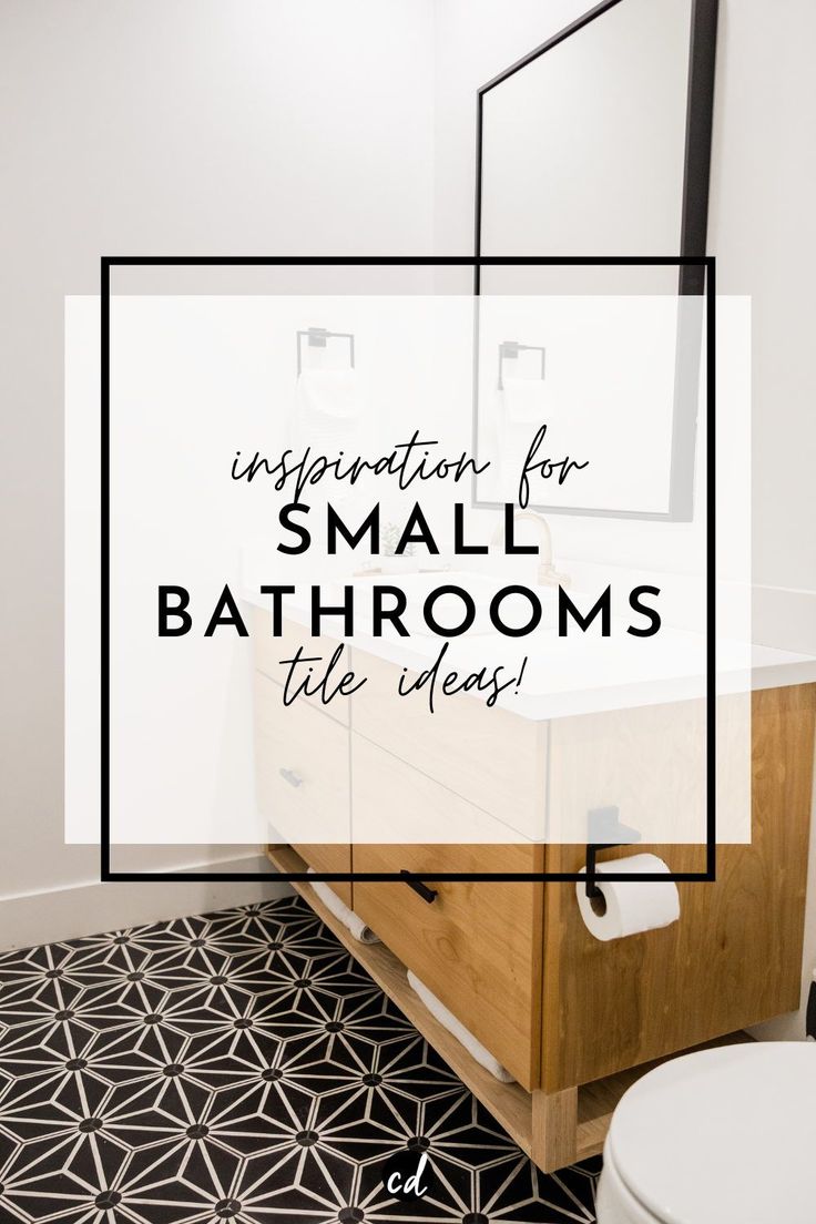 a bathroom with black and white tile flooring and a wooden cabinet in the middle