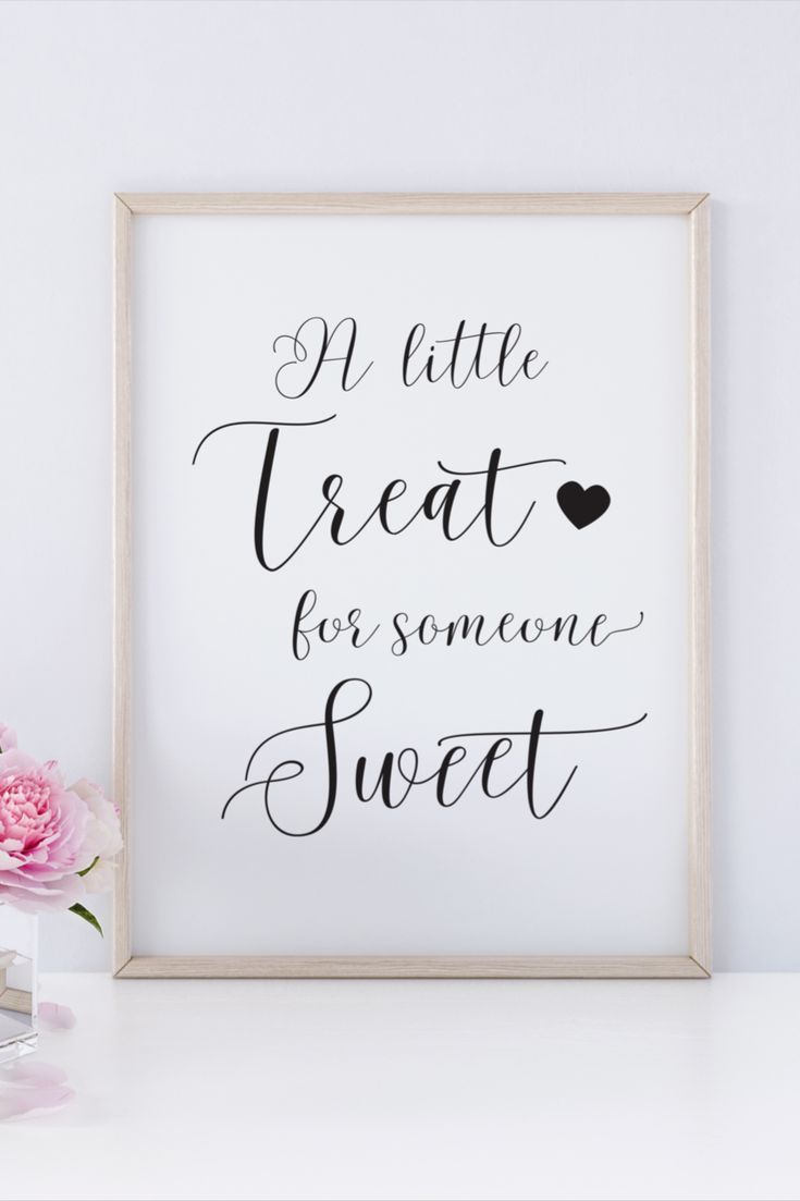 a white framed poster with the words sweet on it next to pink flowers and a vase