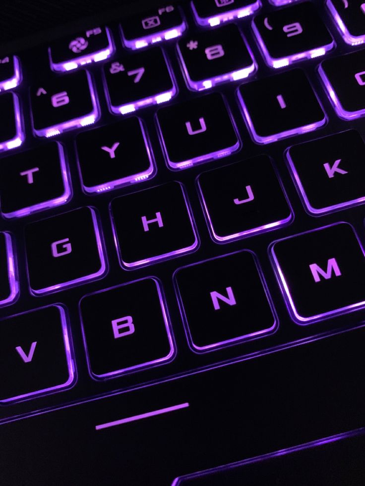 the keyboard is glowing purple and black