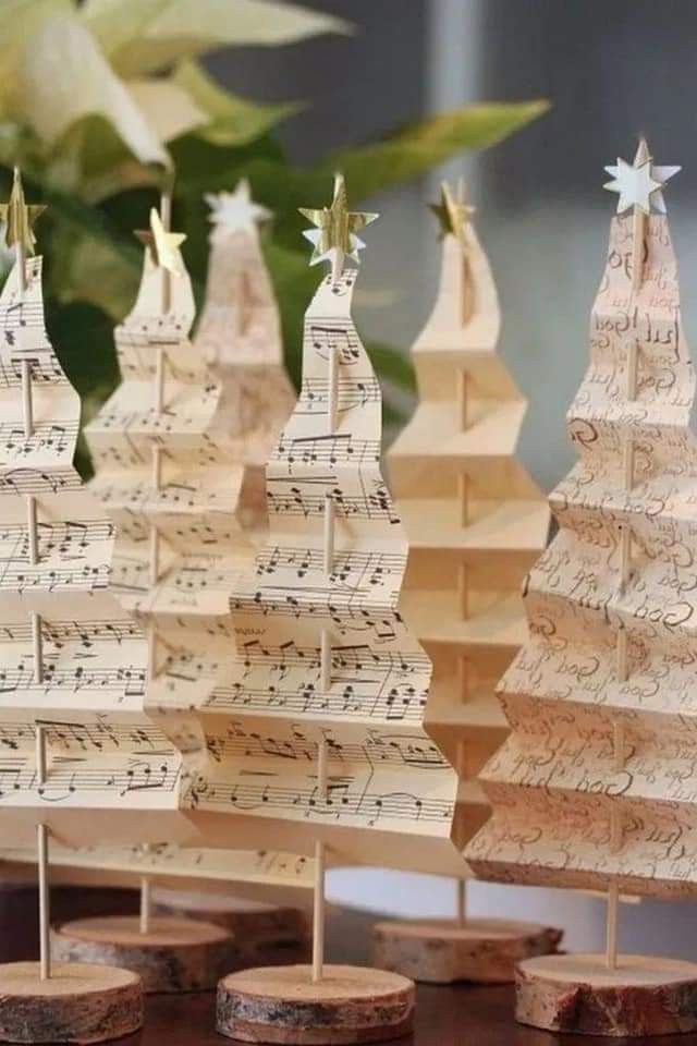 small wooden christmas trees with musical notes on them