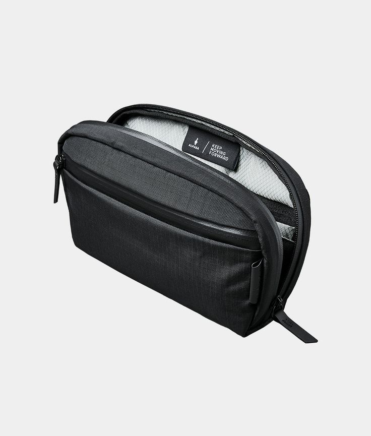 an empty black toiletry bag on a white background