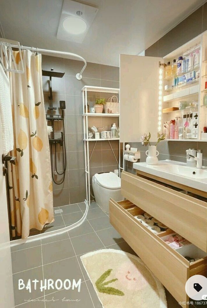 a bathroom with a sink, toilet and shower