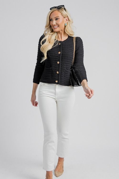 Elevate your wardrobe with this chic cardigan. Textured black trimmed gold buttons down the front give you the option to wear it open or closed. Patch pockets complete the look. Chic Button-up Cardigan With Pockets, Chic Button-up Business Casual Cardigan, Chic Button-up Cardigan For Business Casual, Chic Cotton Cardigan For Work, Button-up Cardigan With Button Closure For Office, Chic Cotton Sweater With Buttons, Black Button-up Cardigan For Business Casual, Fall Cardigan With Buttons For Office, Elegant Cotton Cardigan With Buttons