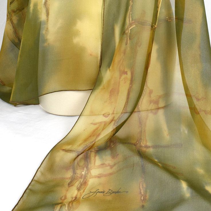 If you love green. . . This lovely green scarf has lots of green color variation with golds, yellows and browns. Dyed first with metal, this scarf was then painted with color. Wide enough and long enough to be a shawl, this piece offers lots of options. Lightweight and can be worn year round. Approximately 20" x 90" Dry Clean Only Gold Bohemian Silk Scarves, Gold Silk Bohemian Scarves, Gold Silk Bohemian Scarf, Vintage Green Silk Shawl, Elegant Handmade Green Silk Scarf, Vintage Green Silk Shawl Scarf, Shawl Outfit, Wearable Art Fashion, Artistic Hand-dyed Silk Scarves