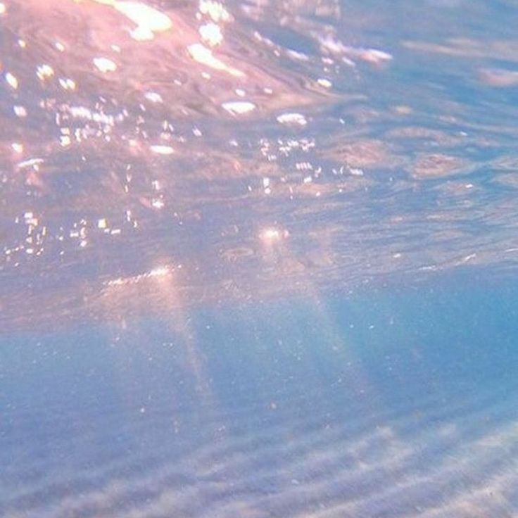 the sun shines through the water as it reflects on the ocean's surface