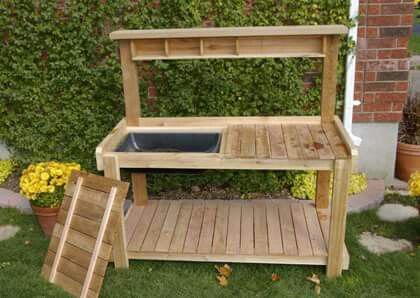 a potting bench made out of wooden pallets