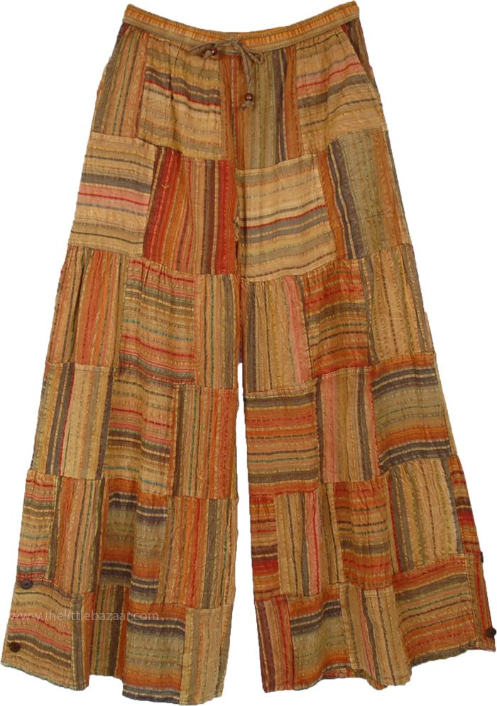 A fun, fierce and offbeat patchwork pattern orange cotton wide leg pants with elastic drawstring waist. They have horizontal and vertical striped patches stitched in and alternating pattern giving a cool artsy look perfect for the summer. #tlb #SplitSkirtsPants #Pocket #vacationclothing #beachwrap #Striped #bohemianfashion #WideLegCottonPants #PatchworkPants #OrangePants #BohoPantswithPockets Brown Patchwork Wide Leg Bottoms, Summer Brown Patchwork Pants, Brown Patchwork Summer Pants, Brown Patchwork Pants For Summer, Multicolor Cotton Harem Pants For Fall, Multicolor Bohemian Harem Pants For Fall, Bohemian Multicolor Harem Pants For Fall, Bohemian Multicolor Fall Harem Pants, Bohemian Wide Leg Striped Pants