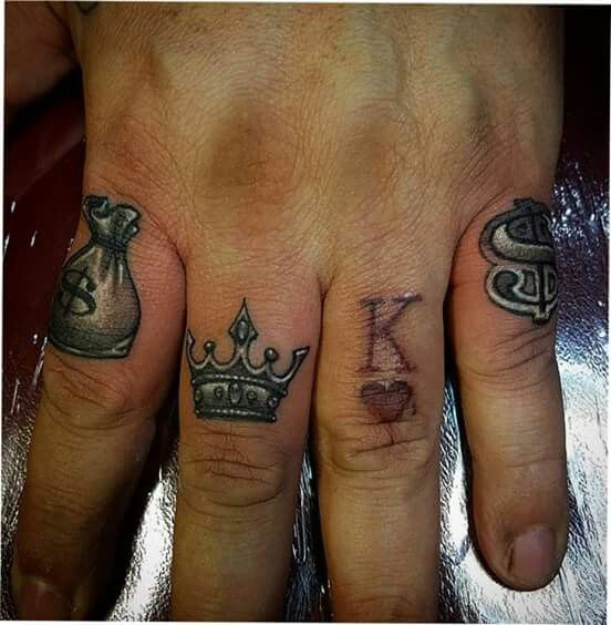 two people with matching tattoos on their fingers