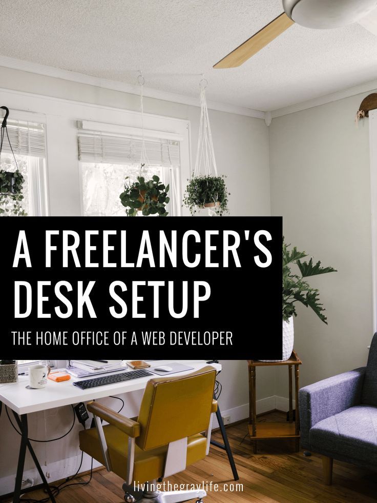 a desk and chair in a room with the words, a freelancer's desk setup